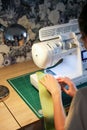 Sewing, stitching and overlocking on a machine at home Royalty Free Stock Photo