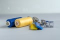 Sewing supplies and needlework accessories blue and yellow colors. Tailoring and craft concept Royalty Free Stock Photo