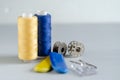 Sewing supplies and needlework accessories blue and yellow colors. Tailoring and craft concept Royalty Free Stock Photo
