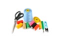 Sewing supplies (thread, scissors and measuring tape) isolated on a white Royalty Free Stock Photo