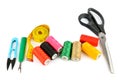 Sewing supplies (thread, scissors and measuring tape) isolated on a white Royalty Free Stock Photo