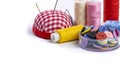 Sewing supplies on a white background close-up, place for text, home crafts and creativity concept, copy space