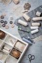 Sewing supplies on a wood table. Vertical Royalty Free Stock Photo