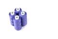 Four standing purple sewing threads Royalty Free Stock Photo