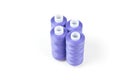 Four standing purple sewing threads Royalty Free Stock Photo