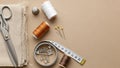 Sewing and Tailoring Essentials Flat Lay on Beige Background Royalty Free Stock Photo