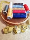 Sewing thread kit in different colors and tailoring meter Royalty Free Stock Photo