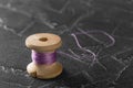 Sewing thread on an old wooden spool Royalty Free Stock Photo