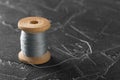 Sewing thread on an old wooden spool Royalty Free Stock Photo