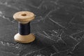 Sewing thread on an old wooden spool Royalty Free Stock Photo