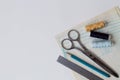 Sewing thread, pencils, ruler, scissors and patterns on a white table of a fashion designer Royalty Free Stock Photo