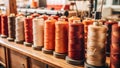 Sewing thread spools in row in a textile factory Royalty Free Stock Photo