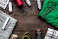 Sewing tools, fabric and kit for hobby collection on wooden background top view mock-up Royalty Free Stock Photo