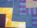 Sewn patchwork cloth from blue and yellow fabrics