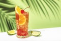 Sex on the beach alcoholic cocktail drink with vodka, peach liqueur, orange and cranberry juice, lemon and ice with red cherry. Royalty Free Stock Photo