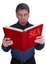 Sex Education, Funny Shocked Man Reading Book Royalty Free Stock Photo