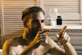 Sex and erotica concept: guy in bathroom with involved look Royalty Free Stock Photo