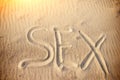 Sex handwritten in sand on a beach Royalty Free Stock Photo