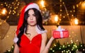 Sex shop. Attractive girl in erotic lingerie hold gift box. Woman with present box. Happy new year. Merry christmas
