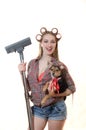 Sexi young blond lady in curlers holding doggy