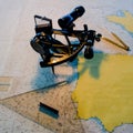 Sextant with a nautical chart in the captain`s cabin