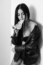 Sexual appetite. Sexy girl eating pizza. Pizza delivery. Restaurant food. Attractive woman leather jacket naked body Royalty Free Stock Photo