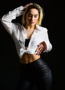 Sexual fetish concept. Portrait of sexy woman on black background. Wearing his shirt. Perfect body shapes. Sensual model Royalty Free Stock Photo