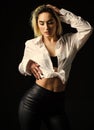 Sexual fetish concept. Portrait of sexy woman on black background. Wearing his shirt. Perfect body shapes. Sensual model Royalty Free Stock Photo