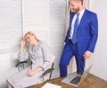 Sexual harassment between colleagues and flirting in office. Workplace bullying concept. Bullying at work. Royalty Free Stock Photo