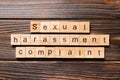 Sexual harassment complaint word written on wood block. Sexual harassment complaint text on table, concept Royalty Free Stock Photo