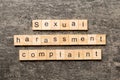 Sexual harassment complaint word written on wood block. Sexual harassment complaint text on table, concept Royalty Free Stock Photo