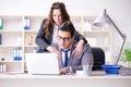 The sexual harassment concept with man and woman in office Royalty Free Stock Photo