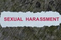 Sexual harassment word on a cut out newspaper