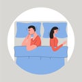 Sexual or marital problems, disagreement concept. Young couple lying side by side on the bed and ignoring each other Royalty Free Stock Photo
