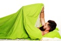 Sexual potency. Imitating erection. Joyful man sleeping on a bed. Wake up Sleepy. Royalty Free Stock Photo