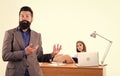 Sexual provocation. Office collective concept. Bearded boss stand in front of sexy girl working laptop. Office manager Royalty Free Stock Photo