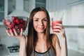 Sexual sports girl drinking a delicious smoothie with berries Royalty Free Stock Photo