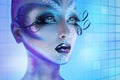 Sexual woman with creative body art. Looking away with blue eyes Royalty Free Stock Photo