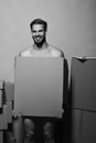 Sexuality and moving concept. Macho with smiling face covers nudity. Man with beard Royalty Free Stock Photo
