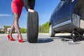 Sexually dressed woman repairing car Royalty Free Stock Photo