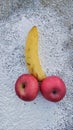 Sexually suggestive banana and red apples