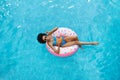 Sexy African American woman with summer drink relaxing on inflatable ring at swimming pool, overhead view Royalty Free Stock Photo