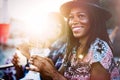 Sexy black woman drinking cocktail in summer and enjoying her vacation Royalty Free Stock Photo