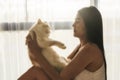 Sexy girl with cat in bedroom