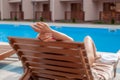 Woman Relaxing Around Swimming Pool In Hotel Royalty Free Stock Photo