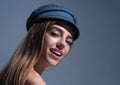 Sexy attractive woman posing with cap. Beautiful sexy model portrait. Beauty woman face. Attractive sensual girl with Royalty Free Stock Photo
