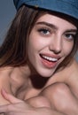 Sexy attractive woman posing with cap. Beautiful sexy model portrait. Beauty woman face. Attractive sensual girl with Royalty Free Stock Photo