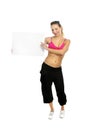 attractive woman in sport pants and gym bra holding blank billboard card with copy space Royalty Free Stock Photo