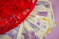 sexy background knickers in gift box and pile of money UK pounds banknotes