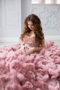 Sexy beatifull pregnant woman at pink dress